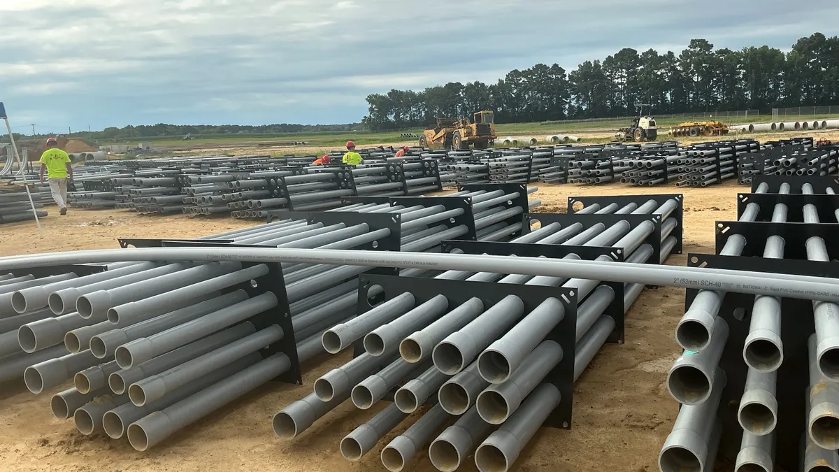 Construction workers prepare the duct bank for installation.