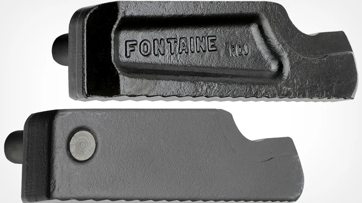 Two heavy-duty cast metal components, each with a rugged, toothed bottom edge.
