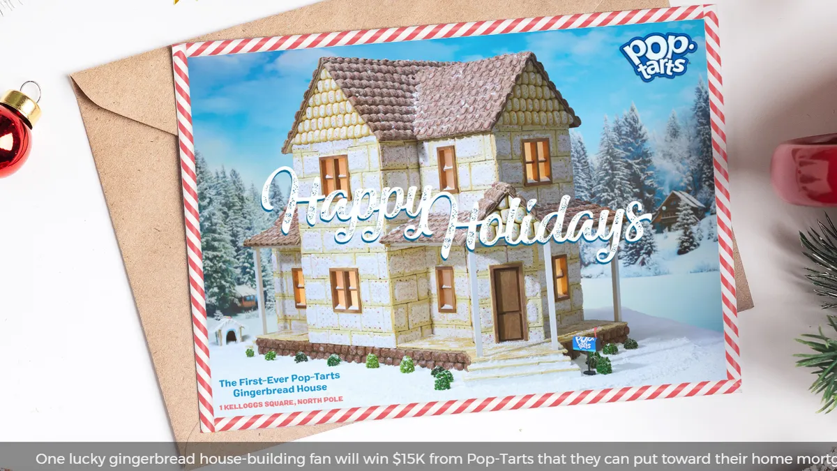 A Christmas card with a gingerbread house printed on it.