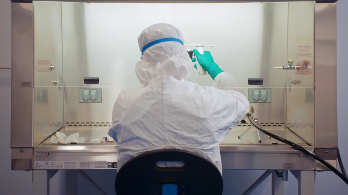 A technician at a Takeda Pharmaceutical laboratory works on cancer cell therapies