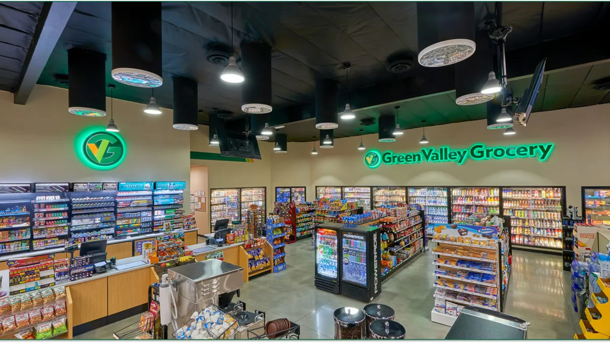 A photo of the interior of a convenience store. A sign on the wall says Green Valley Grocery