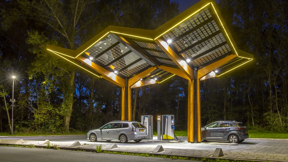 Electric cars charging at electricity filling station