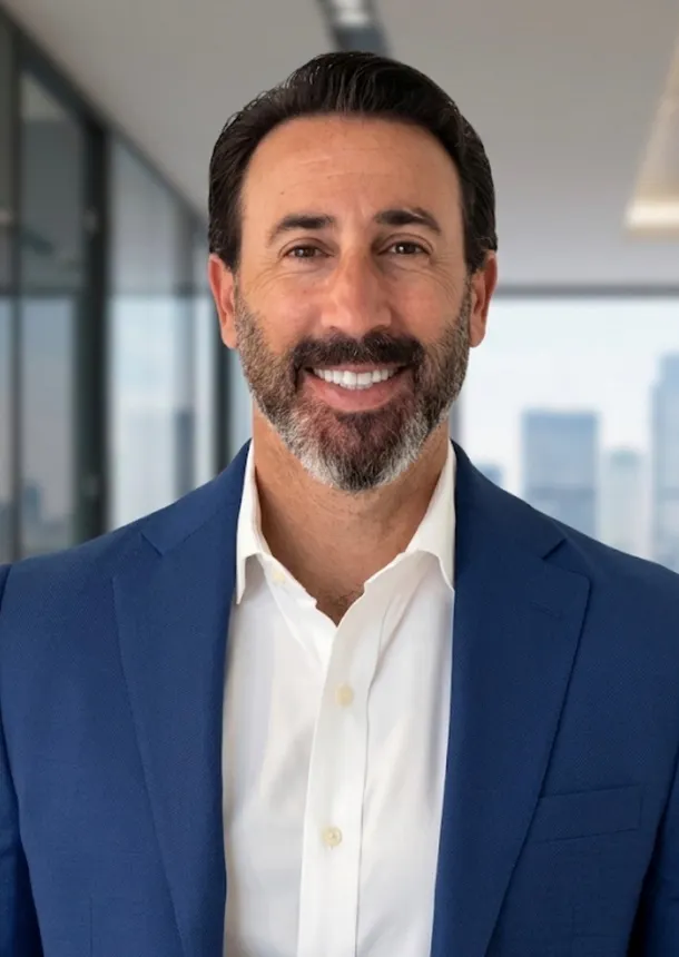 Headshot of a man in professional attire.