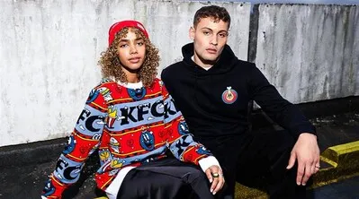 Two models wearing KFC&#x27;s streetwear collection