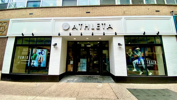 The front door and front windows of an athletic clothing store.