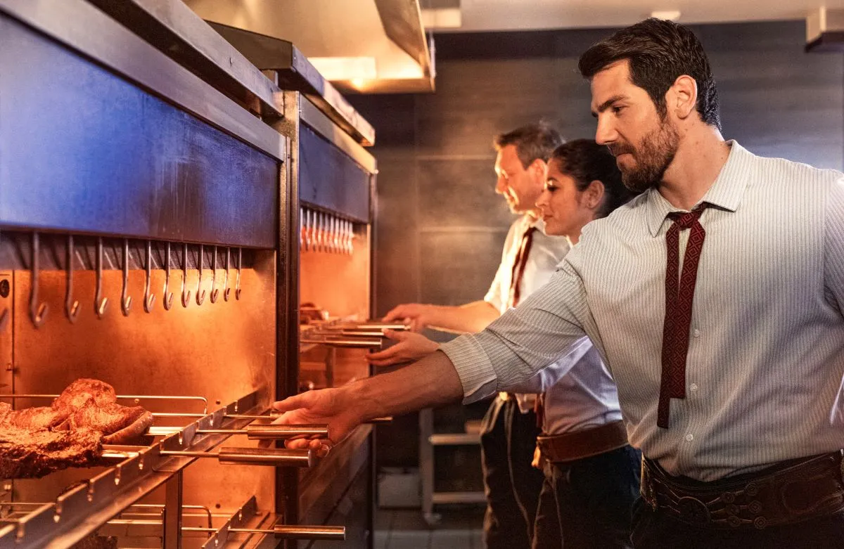 An image of staff fire roasting meat at Fogo de Chao.