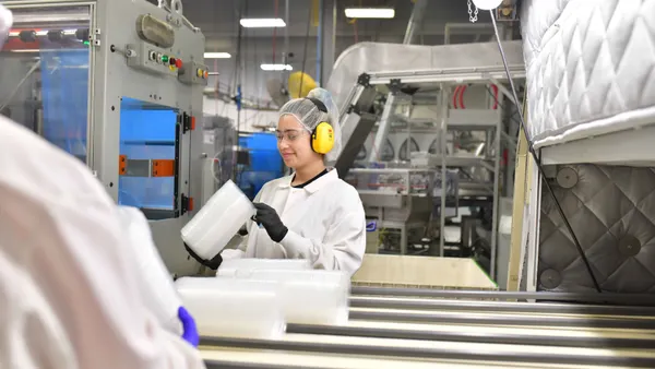 Factory workers on an assembly line