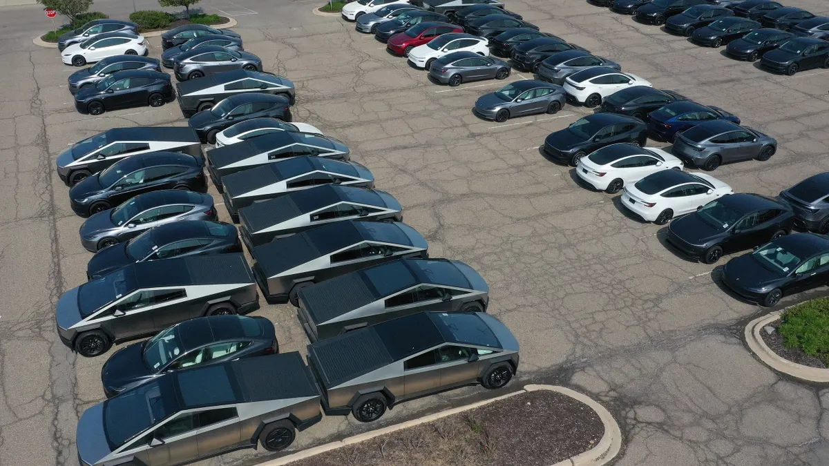 Unsold Tesla cybertrucks sit in the parking lot in a Michigan mall on June 2, 2025