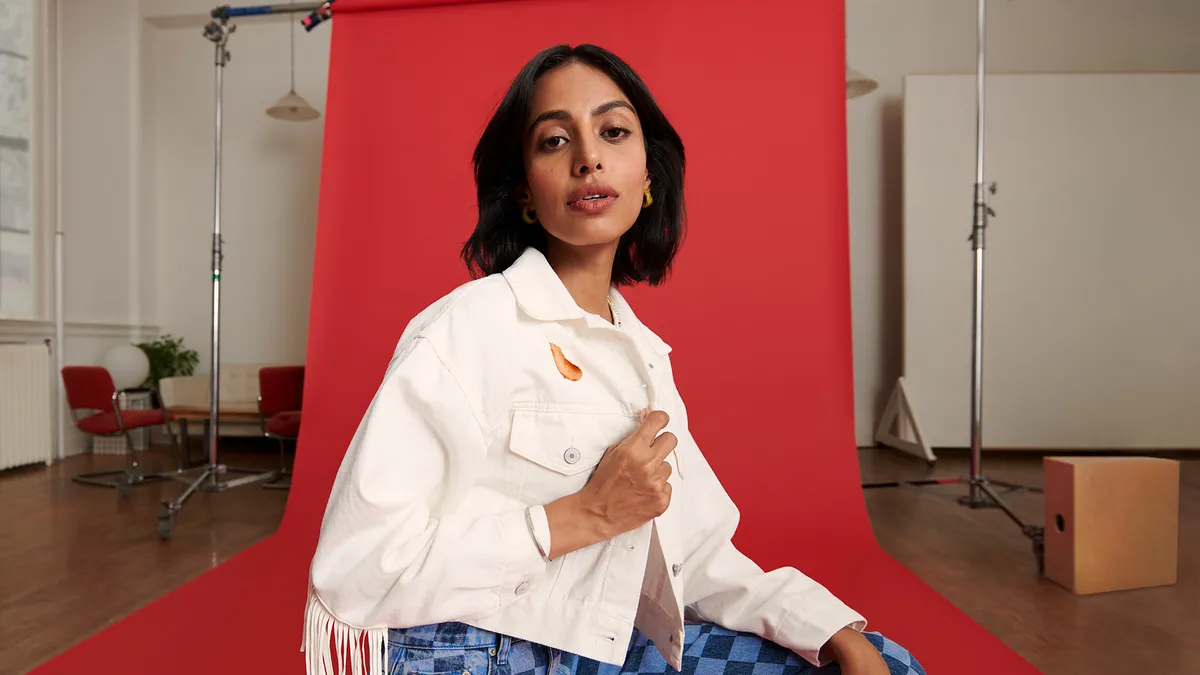 A woman wears a shirt with a Heinz ketchup stain as part of a new vintage clothing collection