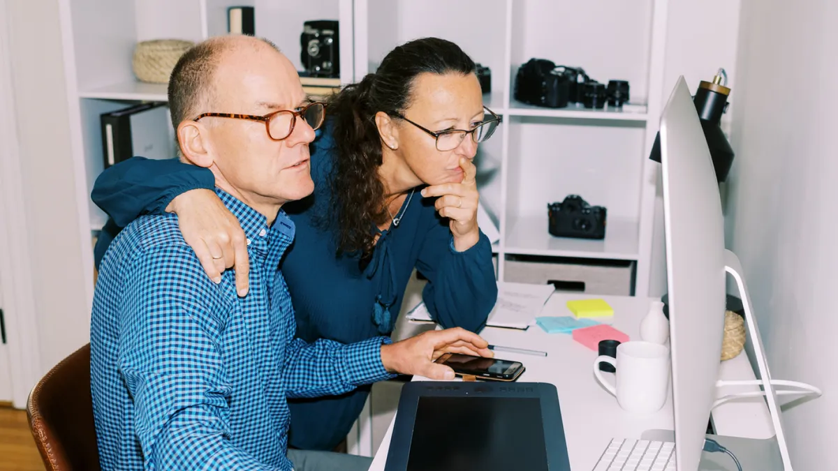 People looking at desktop