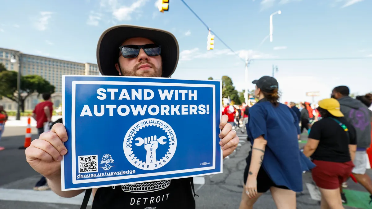 United Auto Workers members rally.