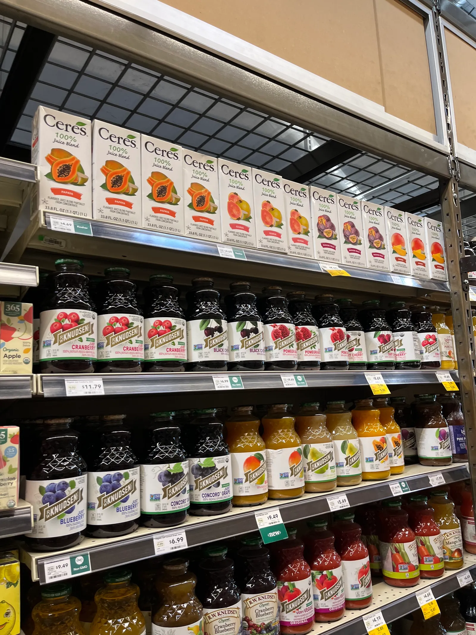 Boxed and bottled juices on store shelves.