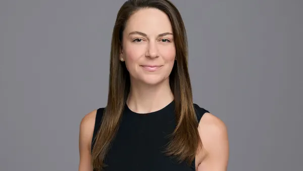 A professional headshot of Katie Tolson.