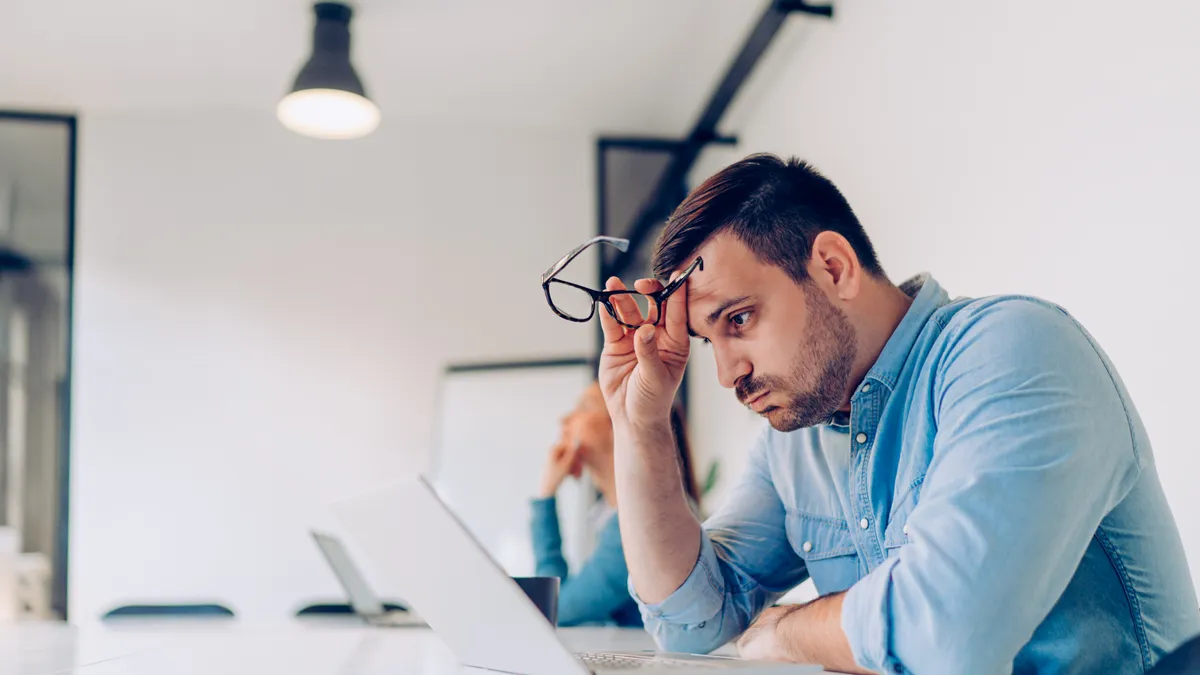 Worried business executive at desk