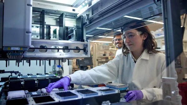 Two people work in the laboratory at Expedition Medicines.
