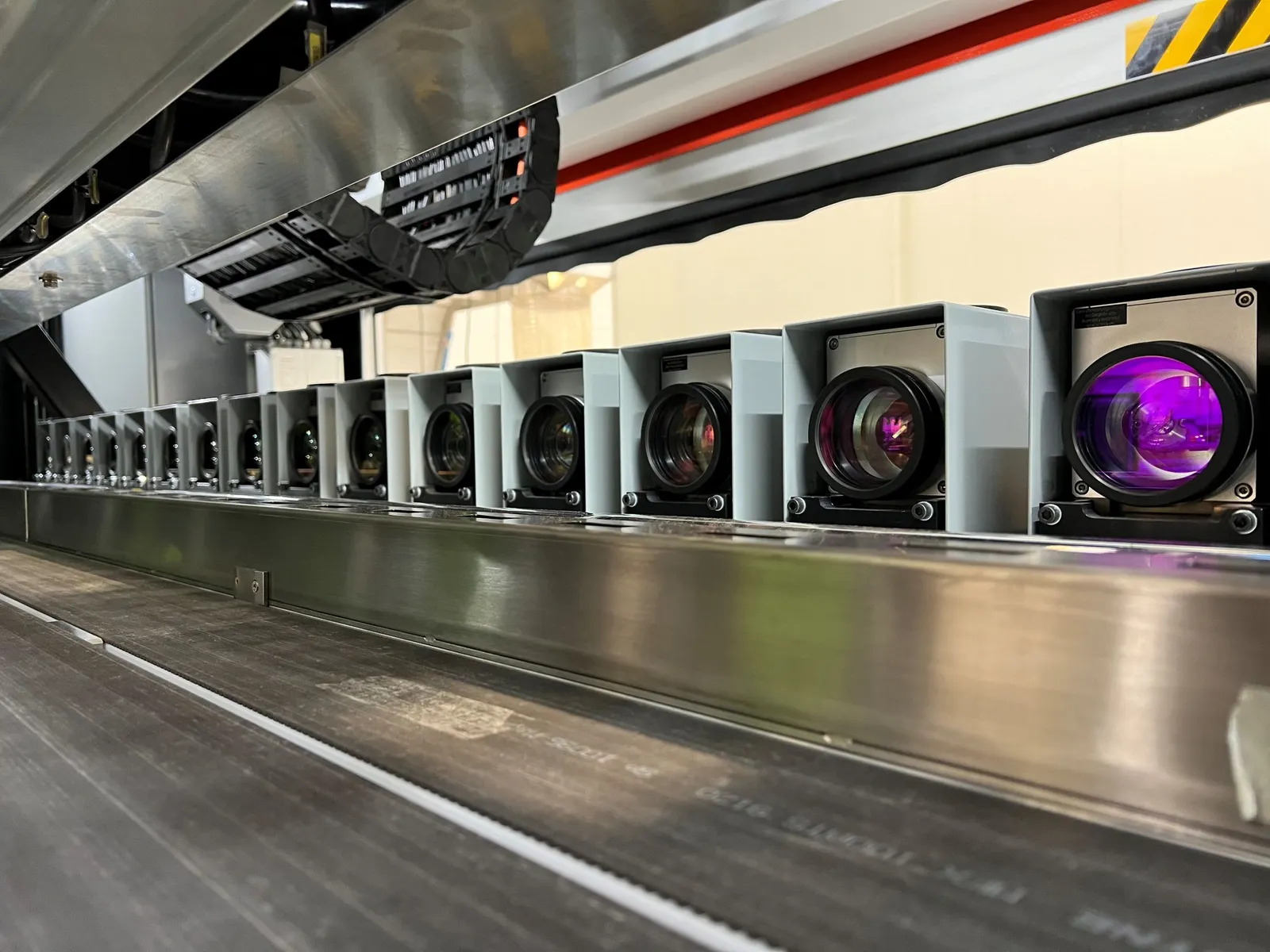 A series of laser marking scan heads on an industrial production line.