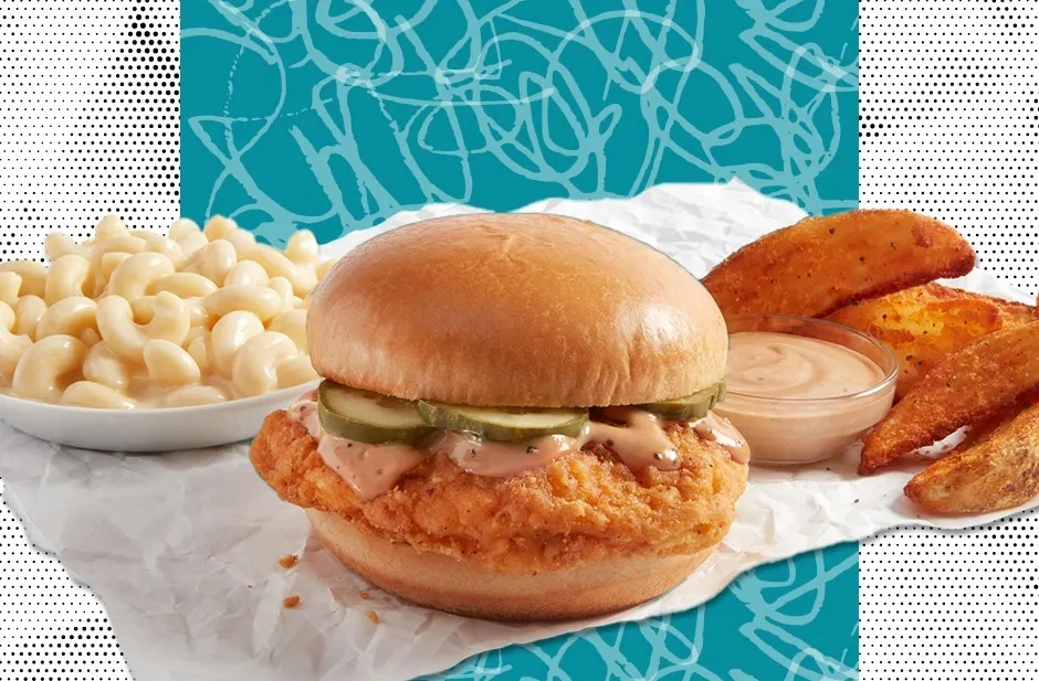 A photo of a chicken sandwich with potato wedges and macaronia dn cheese against a blue and white background.