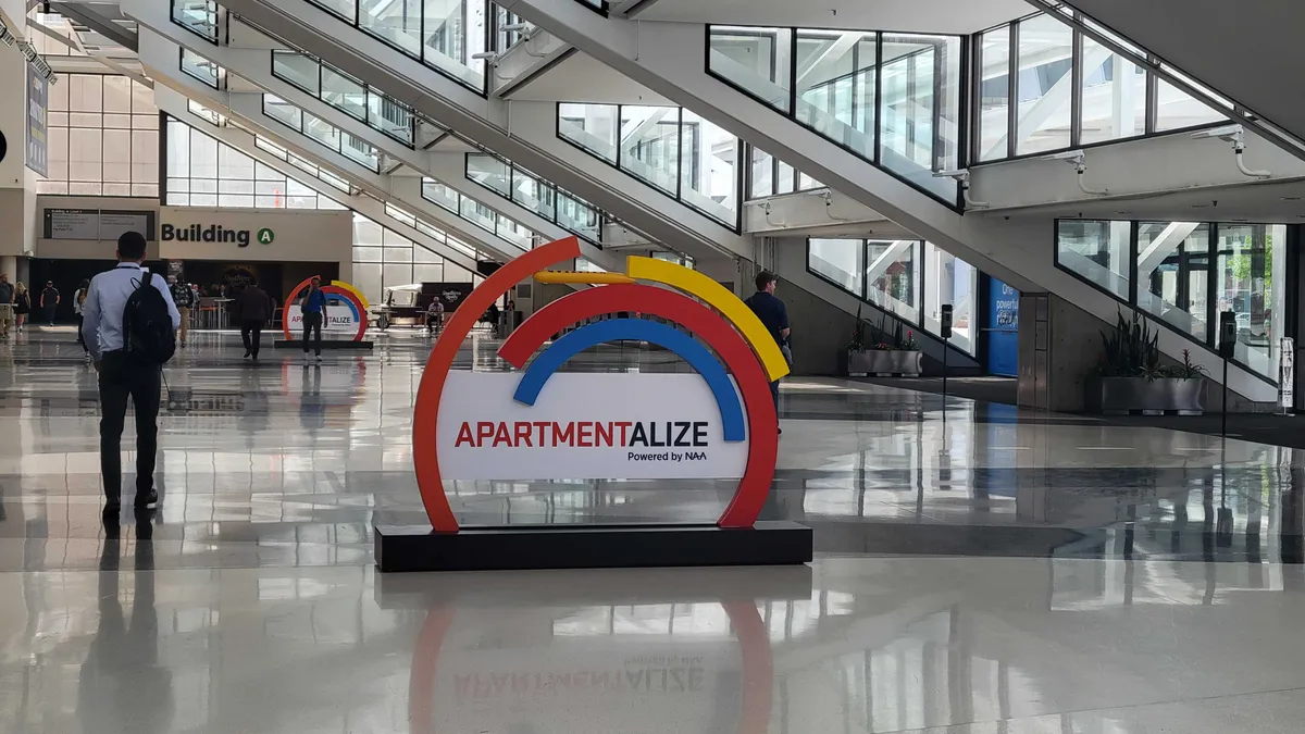 A hallway with a sign that says "Apartmentalize."