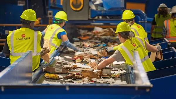 workers sort material at a MRF
