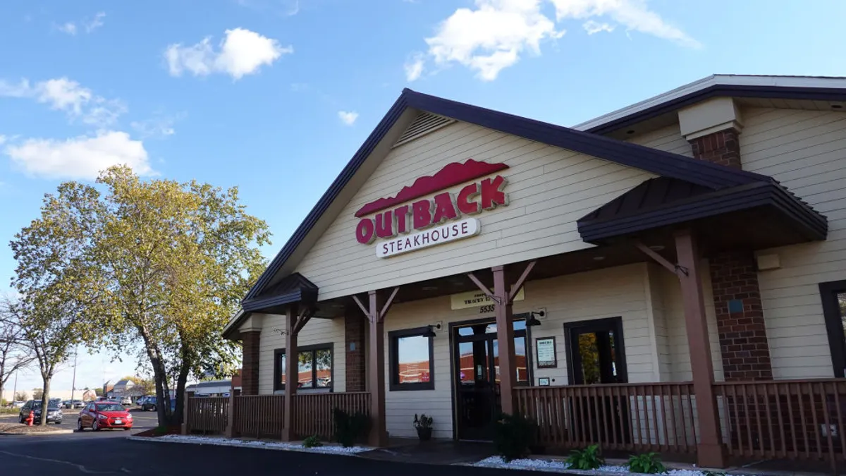 A sign marks the location of an Outback Steakhouse restaurant on November 02, 2021 in Skokie, Illinois.