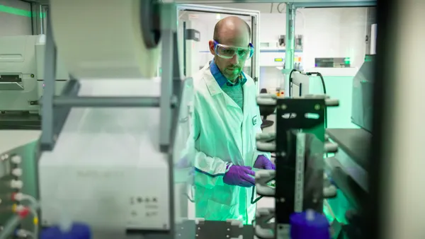 A Bristol Myers Squibb employee works in one of the company's labs.