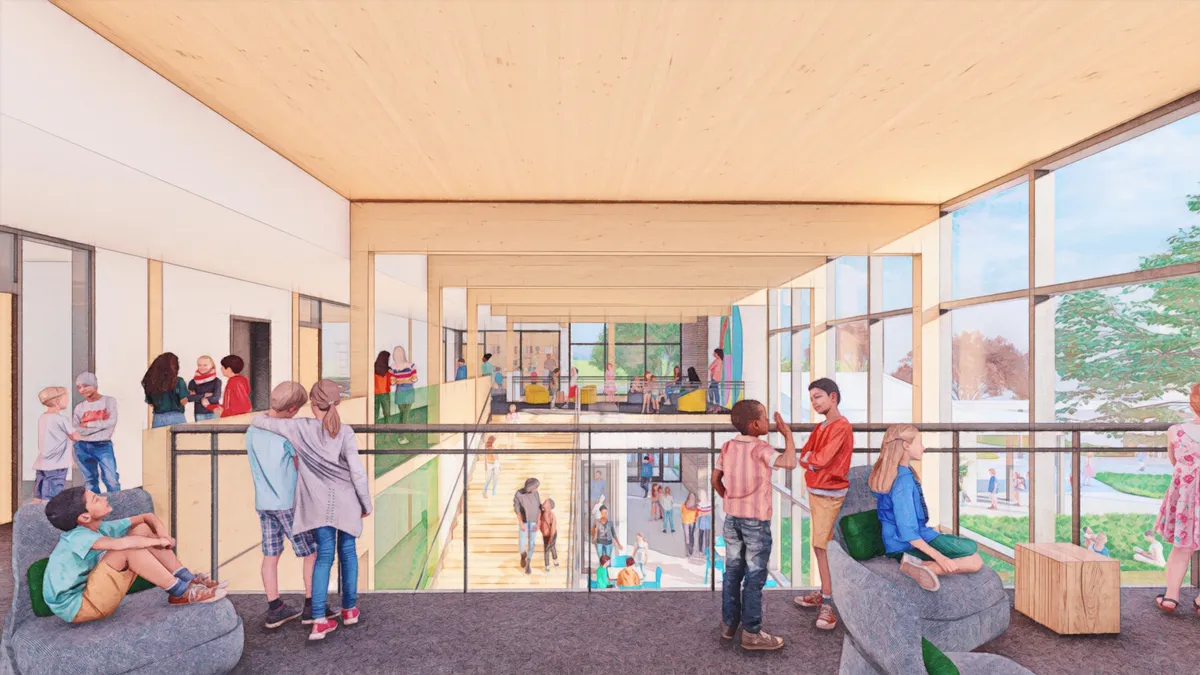 A sketch of a building's interior shows children sitting and talking on the second floor balcony.