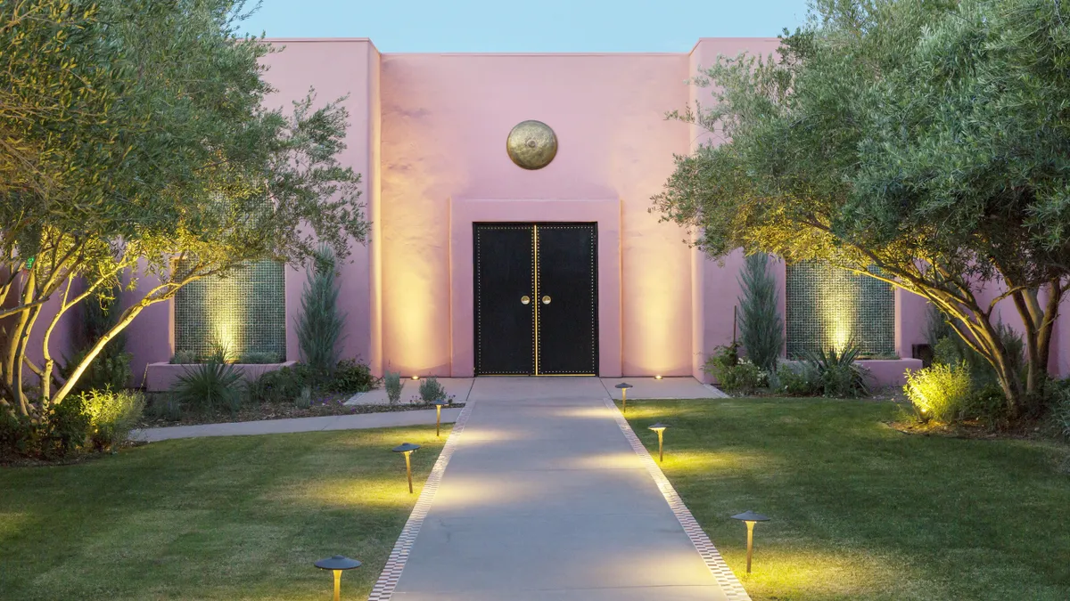 The front entryway features a black door.