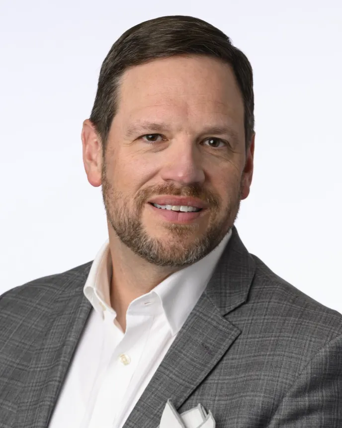 A headshot of Brian Jordan