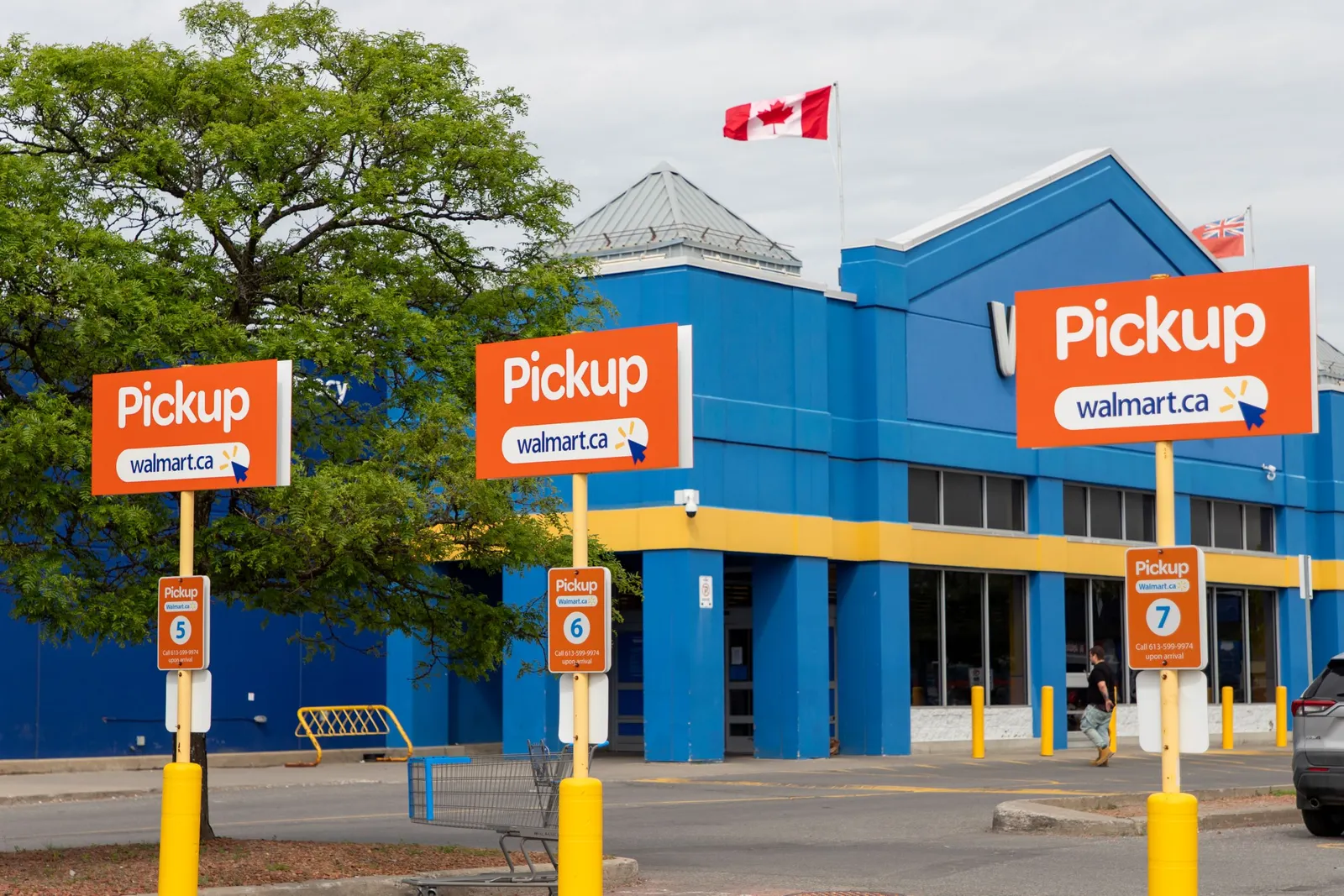 Walmart pickup signs. Parking lot for online grocery orders at the supermarket in Canada, Ontario.