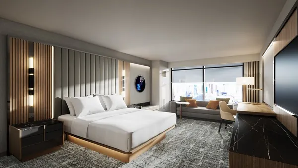 A rendering shows a king bed in a hotel room.