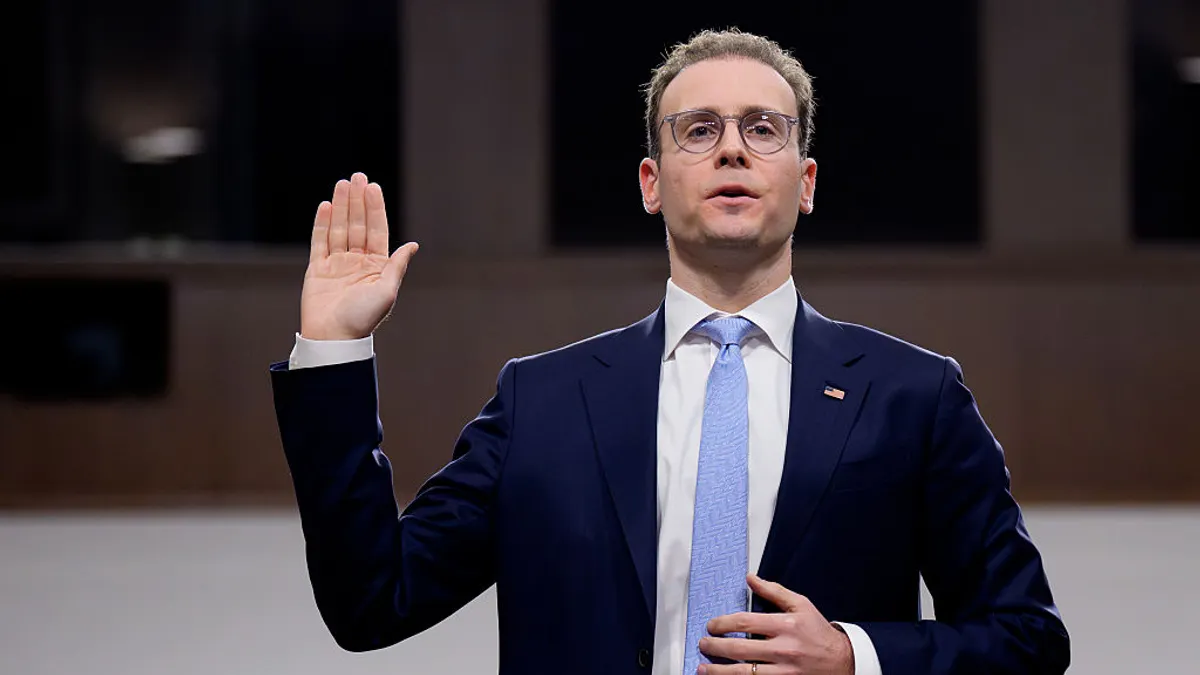 Michael Selig, Commodity Futures Trading Commission chair, holds up his right hand while speaking during a congressional hearing.