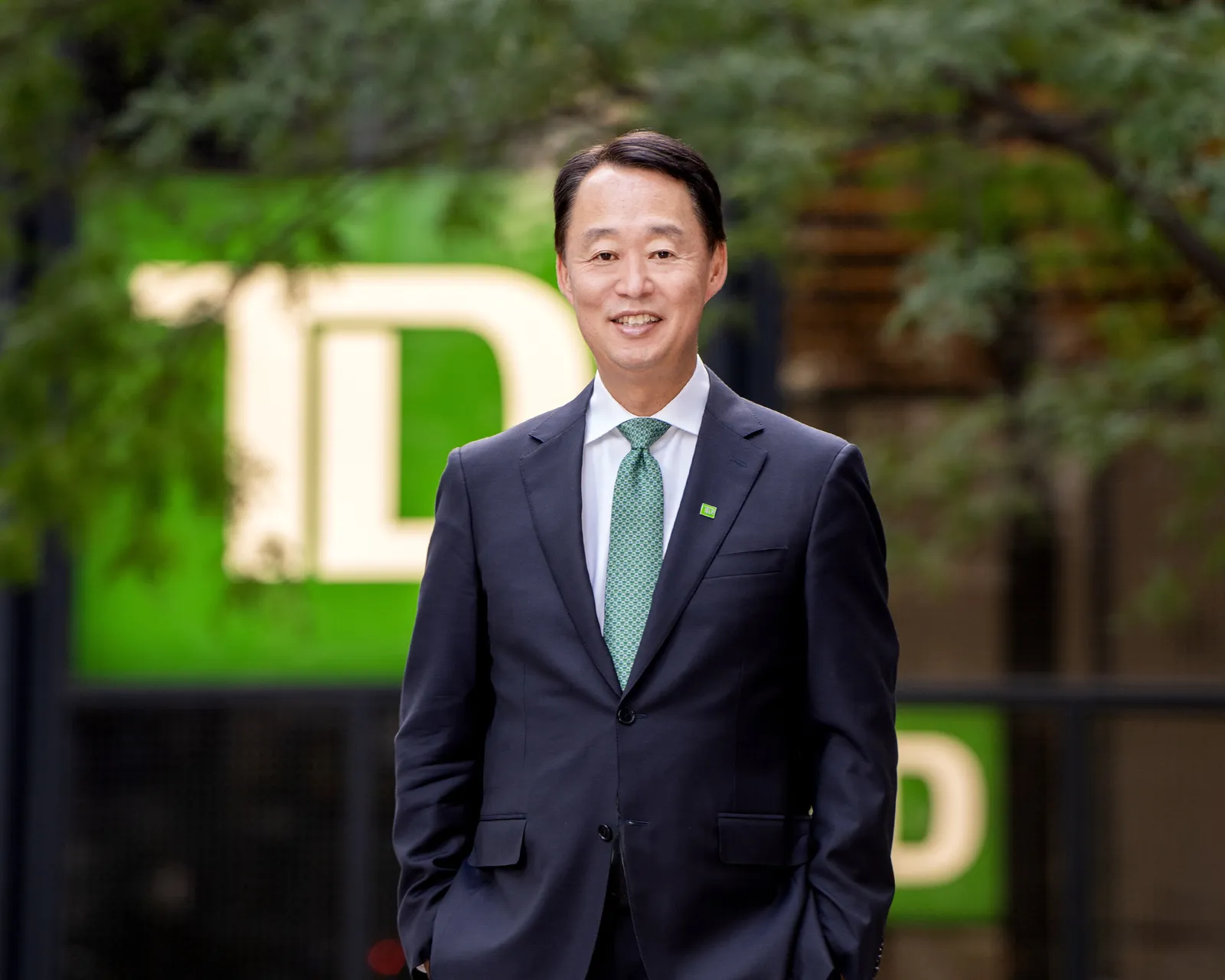 Raymond Chun, TD executive, poses for a photo wearing a suit and tie