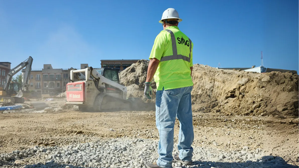 back of person at construction site