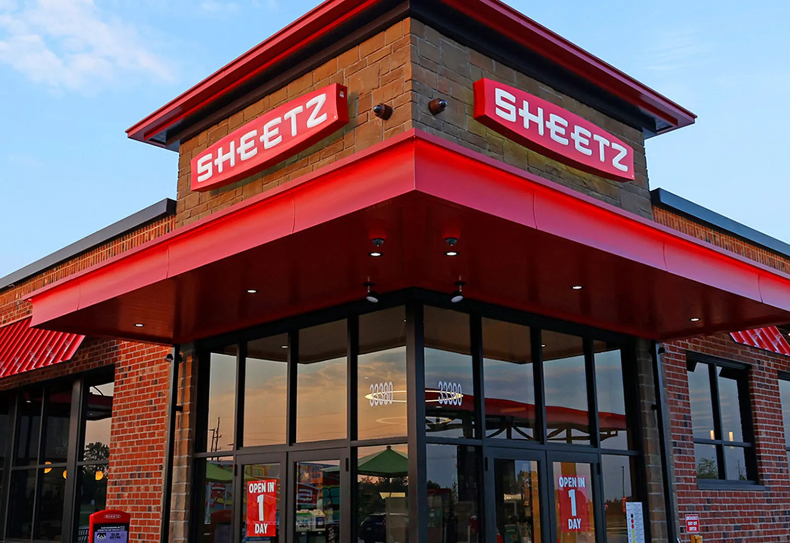 A photo of the exterior of a store. A sign over the door says Sheetz.