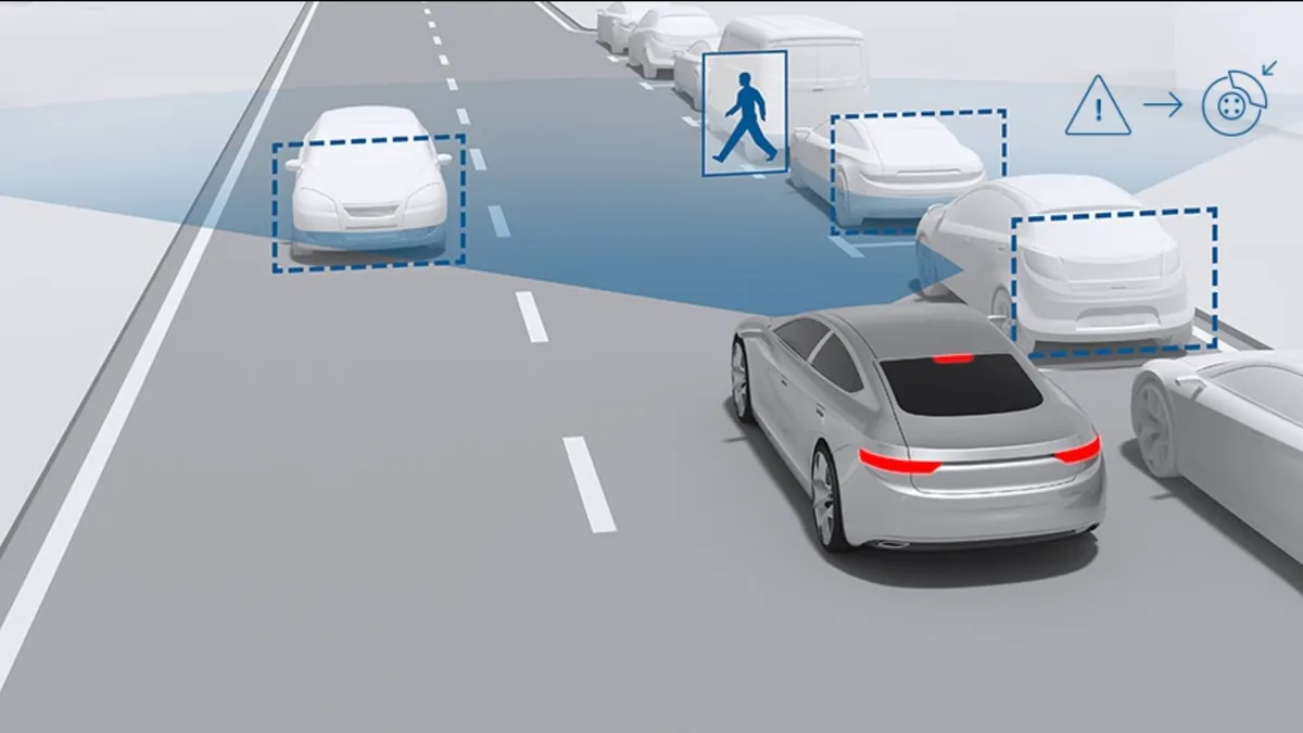 A graphic showing a pedestrian crossing the road in front of a vehicle.