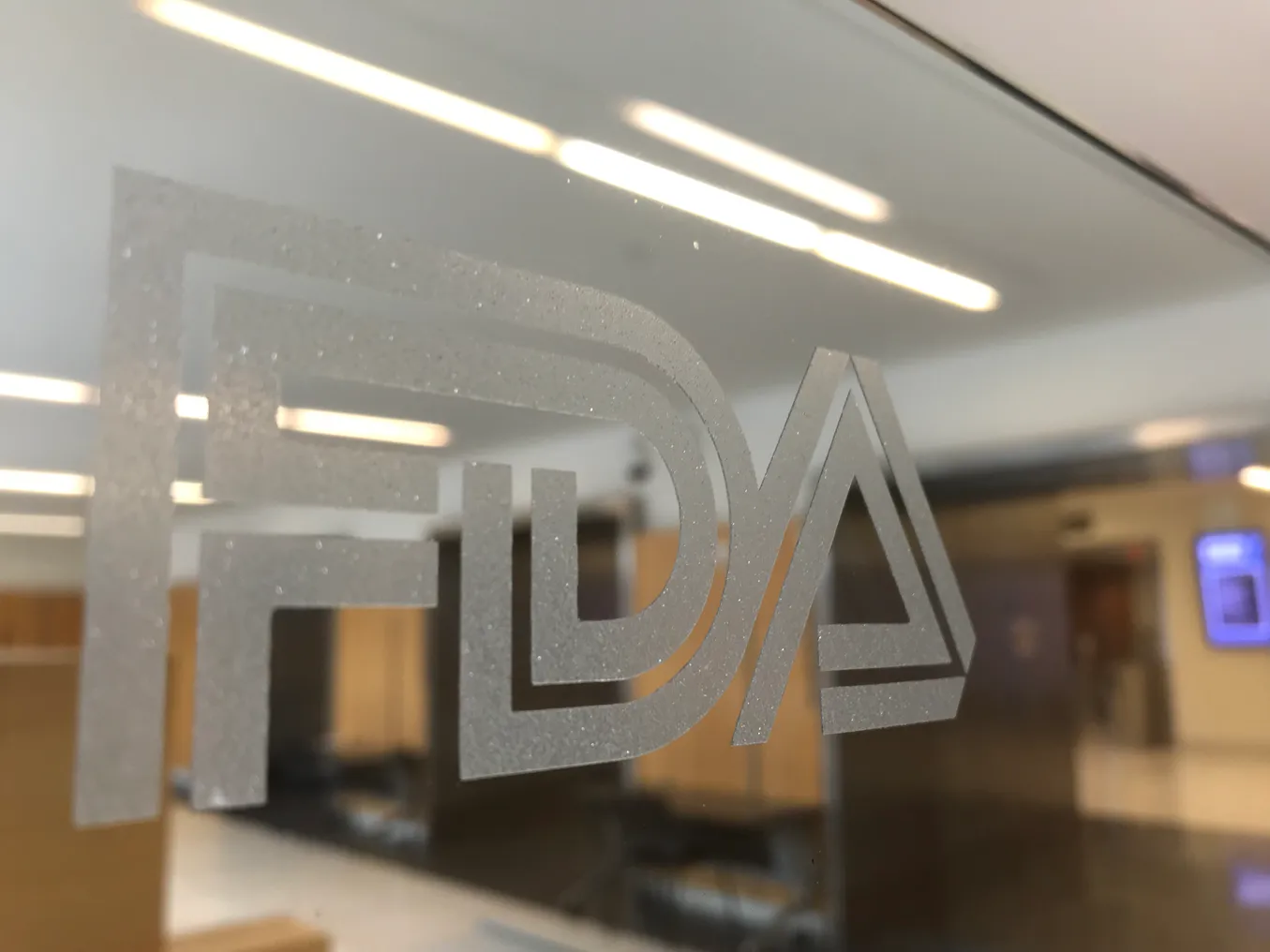 The FDA logo on a glass pane at the agency's campus in Silver Spring, Maryland.