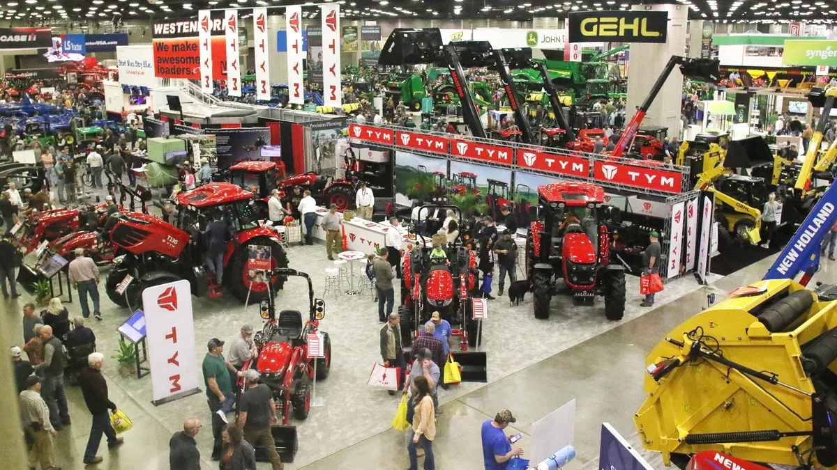 Attendees roam the grounds of the National Farm Machinery Show in Louisville, Kentucky.