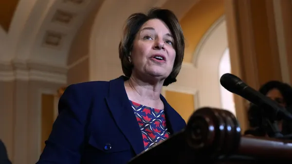 Senator Amy Klobuchar speaks at a podium