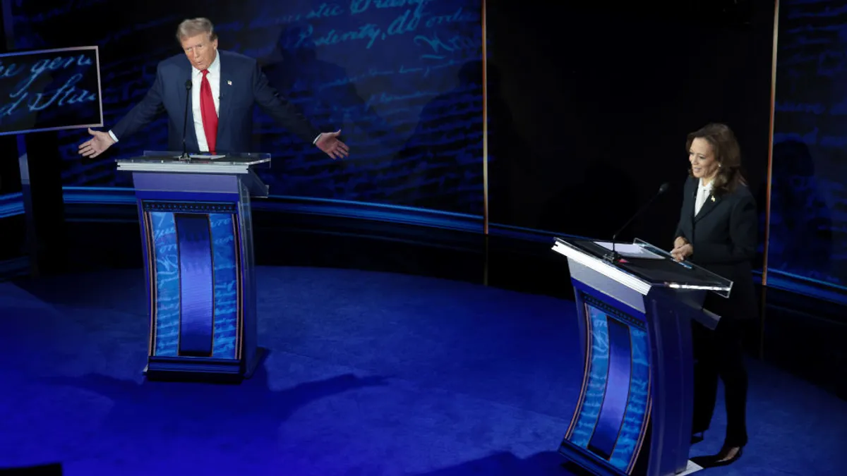 Former President Donald Trump, left, and Vice President Kamala Harris, right, stand behind podiums at a debate.