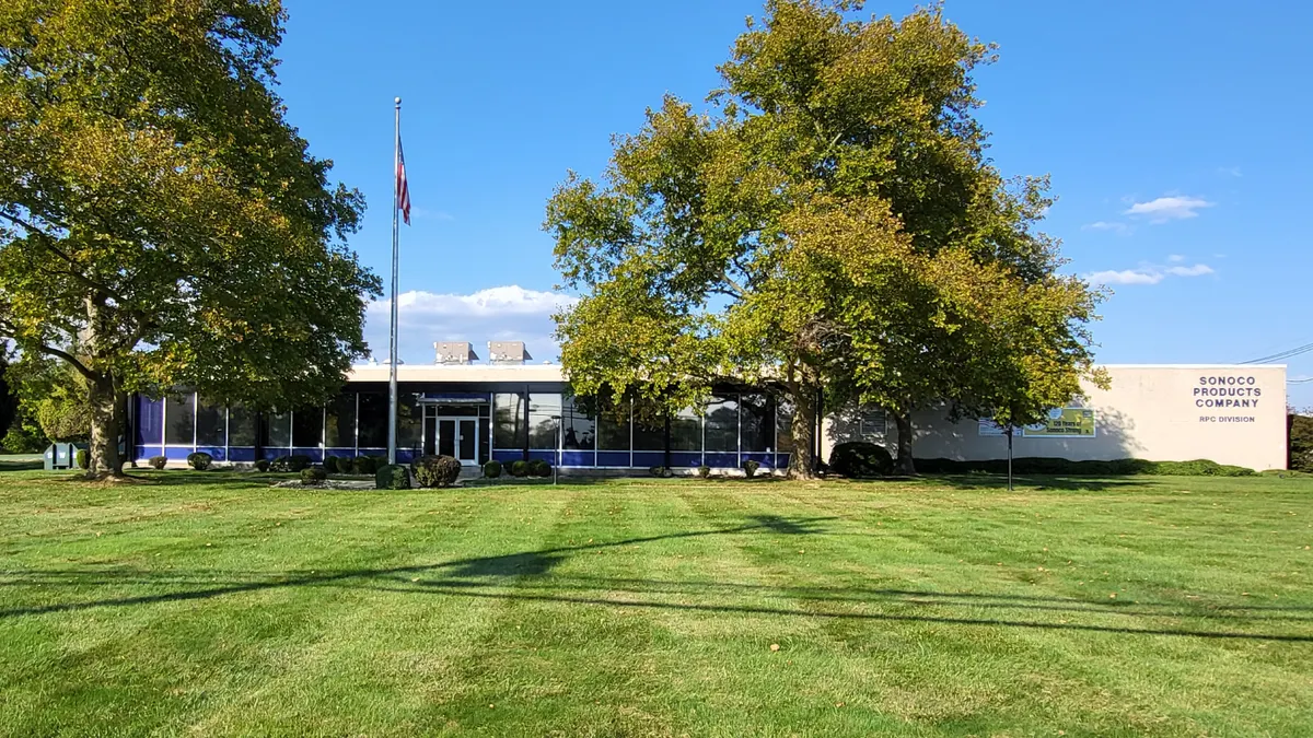 The exterior of a corporate building is labeled as belonging to packaging manufacturer Sonoco.