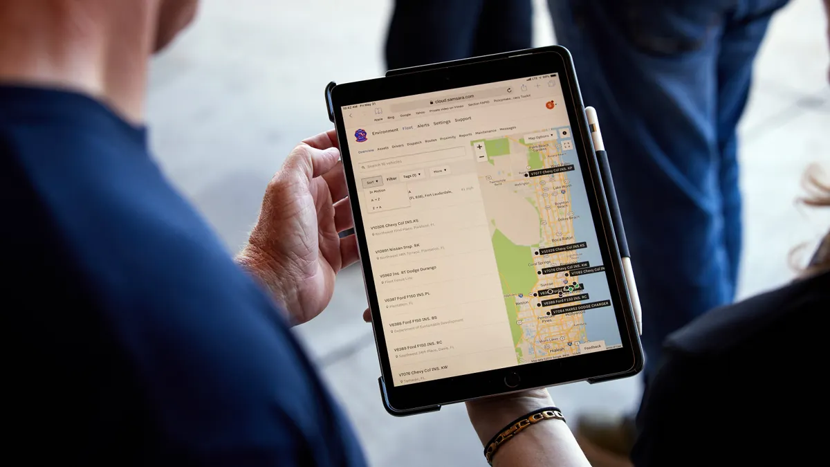 Man looking at tablet screen