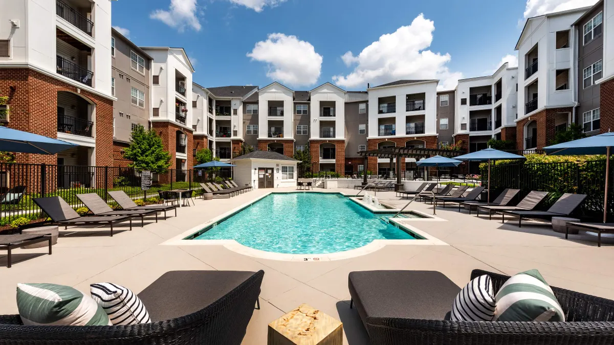 Pool surrounded by apartment building