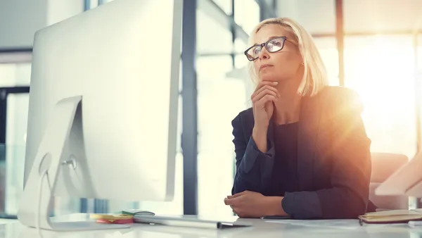 Businesswoman working at her desk