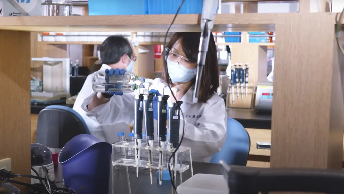 A person works in a laboratory at AltruBio.