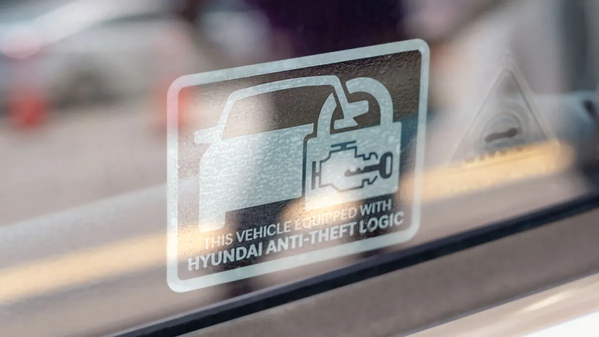 A window sticker on a Hyundai vehicle to deter would-be thieves that reads "This vehicle equipped with Hyundai anti-theft logic."