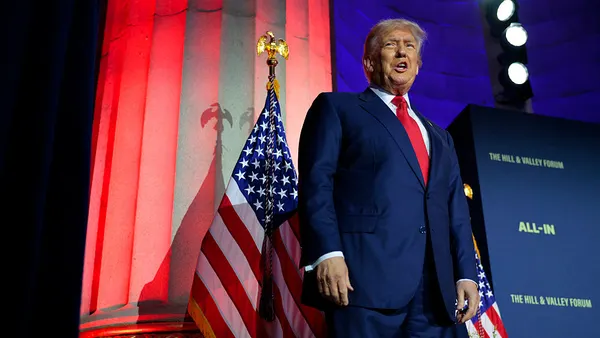 President Donald Trump speaks on stage