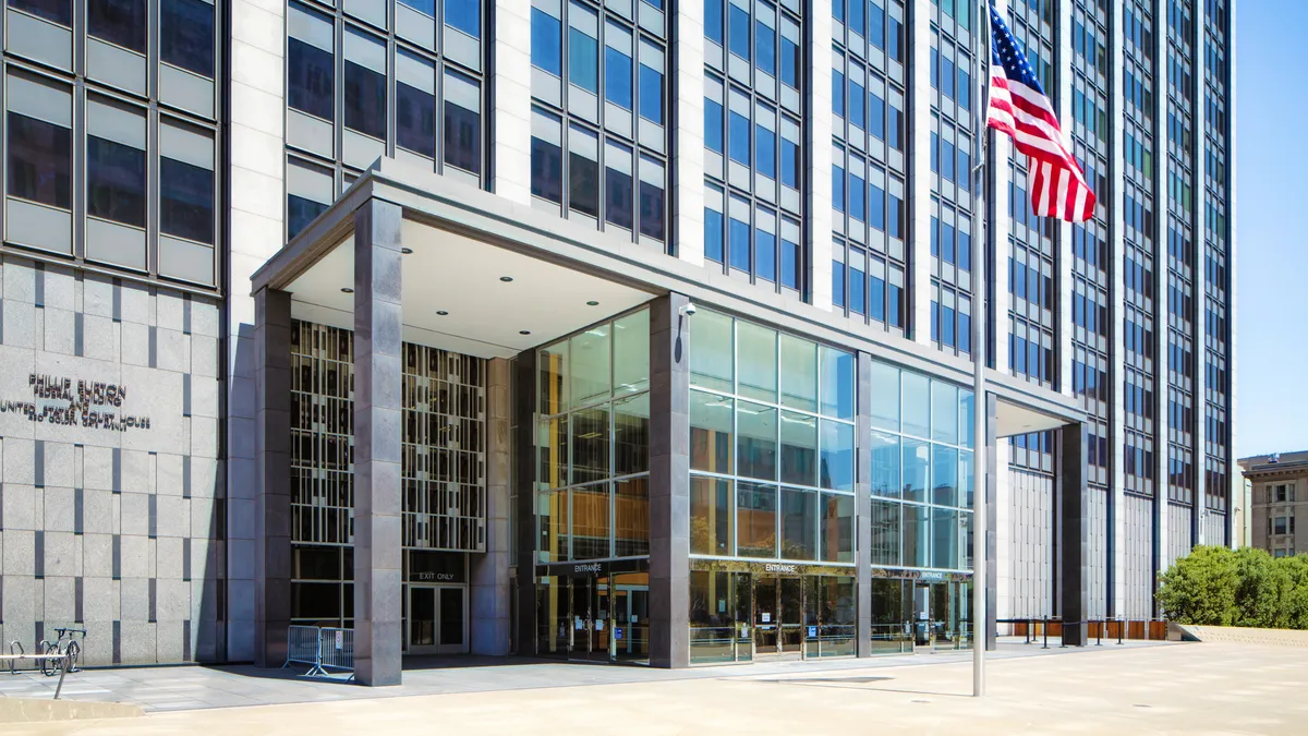 A flag flies over the entryway of the federal courthouse in San Francisco.