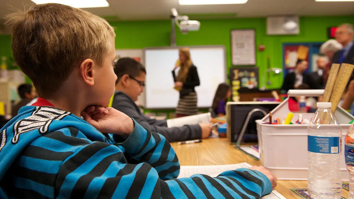 Students listen during an elementary school lesson.