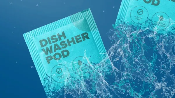 A close-up view of a paper-based sachet with messaging that says dishwasher pod and plastic-free.