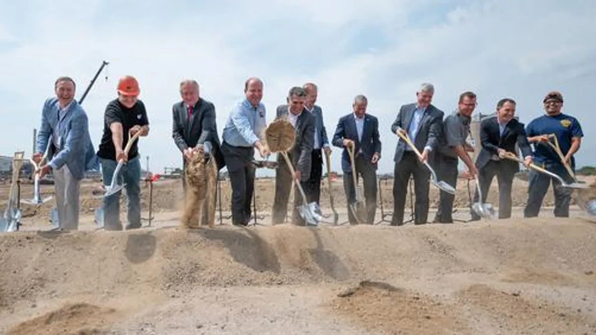 Colorado Gov. Jared Polis and others participate in the groundbreaking of the new EVRAZ solar facility.